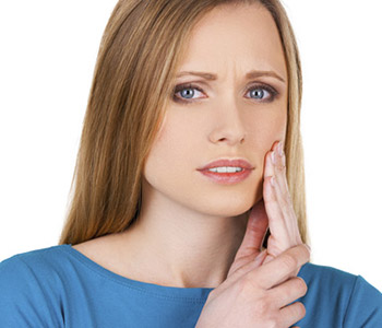 TMJ Disorder Treatment Mayfield Village - Young woman having tooth ache